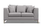 Gray sofa with three cushions on a white background