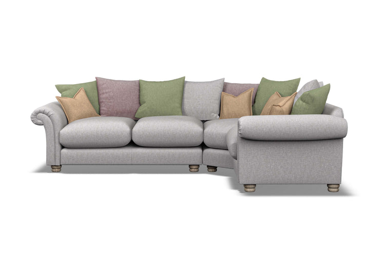 Gray sectional sofa with colorful cushions on a white background