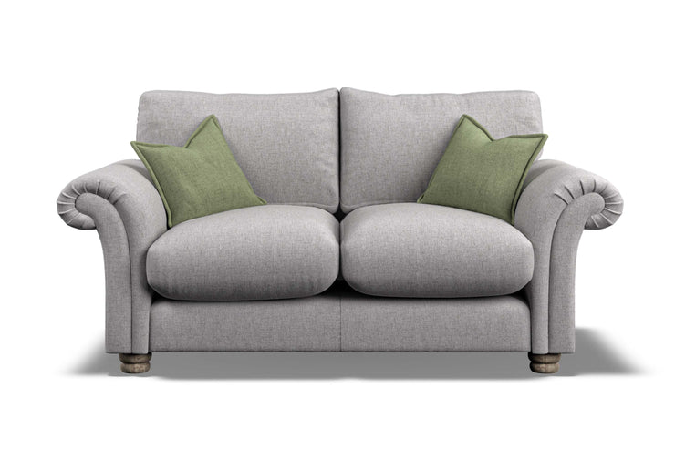 Gray sofa with green cushions on a white background
